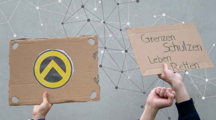 Protestschilder und das Symbol der Identitären Bewegung.